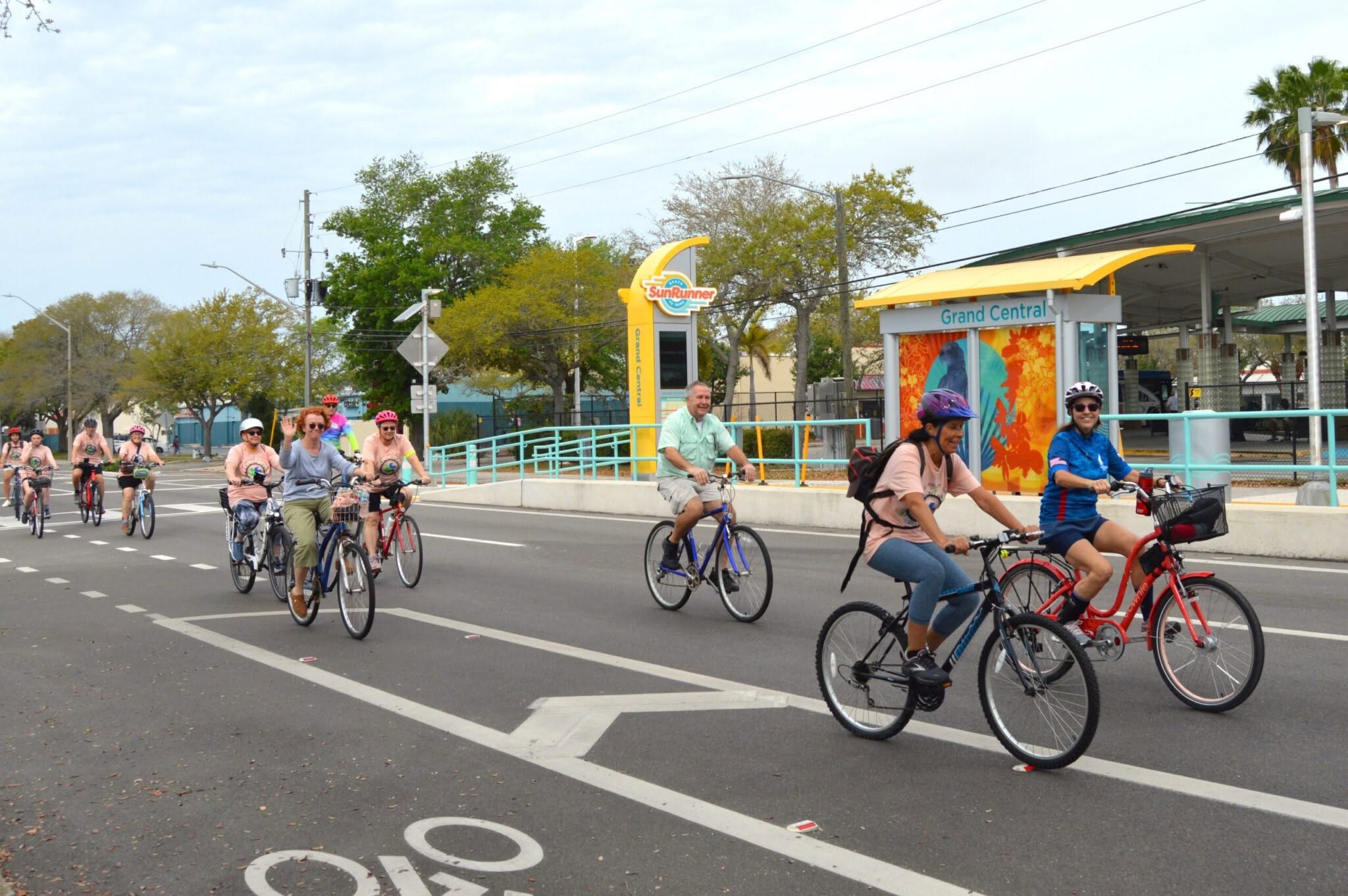 a group of people biking along the bike lane